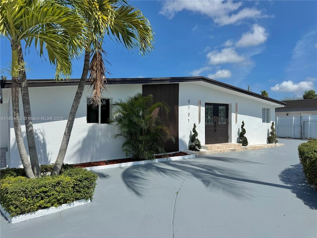 5101 SW 112th Pl, Miami, FL 33165 - view of front of property with stucco siding, driveway, and fence