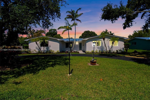 17640 SW 84th Ct, Palmetto Bay, FL 33157 - ranch-style house with stucco siding, a front lawn, and metal roof