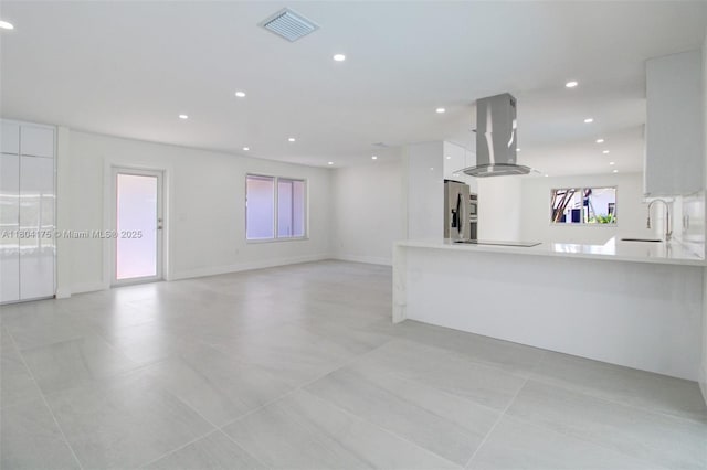 17640 SW 84th Ct, Palmetto Bay, FL 33157 - unfurnished living room featuring a sink, recessed lighting, light tile patterned floors, and baseboards