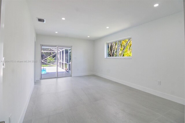 17640 SW 84th Ct, Palmetto Bay, FL 33157 - empty room featuring healthy amount of natural light, baseboards, and recessed lighting