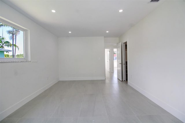 17640 SW 84th Ct, Palmetto Bay, FL 33157 - empty room with plenty of natural light, recessed lighting, baseboards, and light tile patterned floors