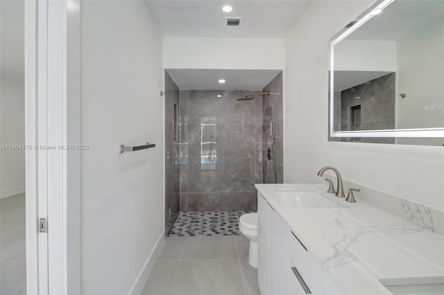 17640 SW 84th Ct, Palmetto Bay, FL 33157 - bathroom featuring toilet, a tile shower, vanity, and tile patterned floors