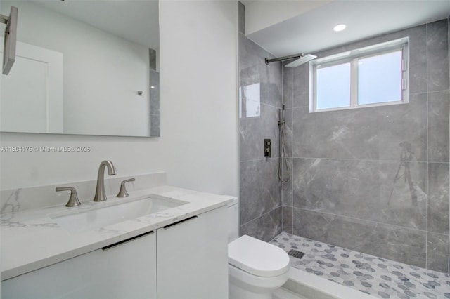17640 SW 84th Ct, Palmetto Bay, FL 33157 - bathroom featuring tiled shower, vanity, and toilet