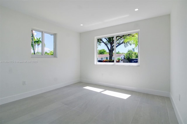17640 SW 84th Ct, Palmetto Bay, FL 33157 - spare room with plenty of natural light, light tile patterned flooring, baseboards, and recessed lighting