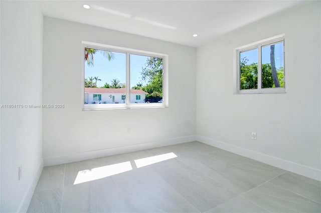 17640 SW 84th Ct, Palmetto Bay, FL 33157 - empty room featuring healthy amount of natural light, recessed lighting, baseboards, and tile patterned flooring