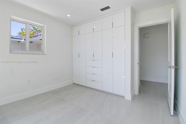 17640 SW 84th Ct, Palmetto Bay, FL 33157 - unfurnished bedroom featuring light tile patterned flooring, a closet, baseboards, and recessed lighting