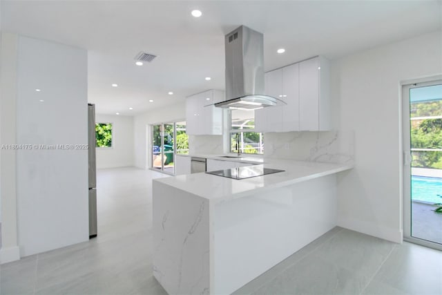 17640 SW 84th Ct, Palmetto Bay, FL 33157 - kitchen with modern cabinets, island range hood, white cabinets, plenty of natural light, and recessed lighting