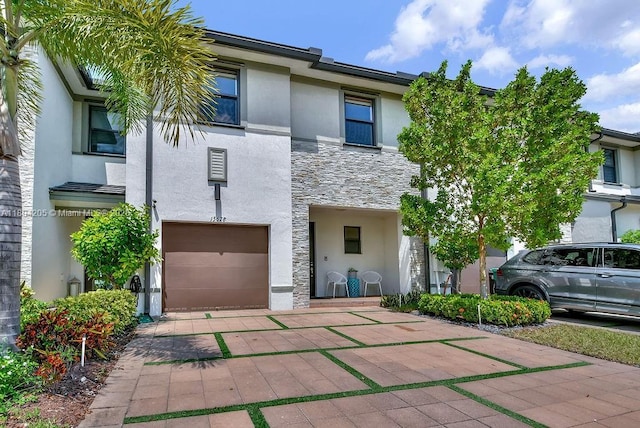 15678 NW 91st Ct, Miami Lakes, FL 33018 - multi unit property featuring stone siding, stucco siding, a garage, and driveway