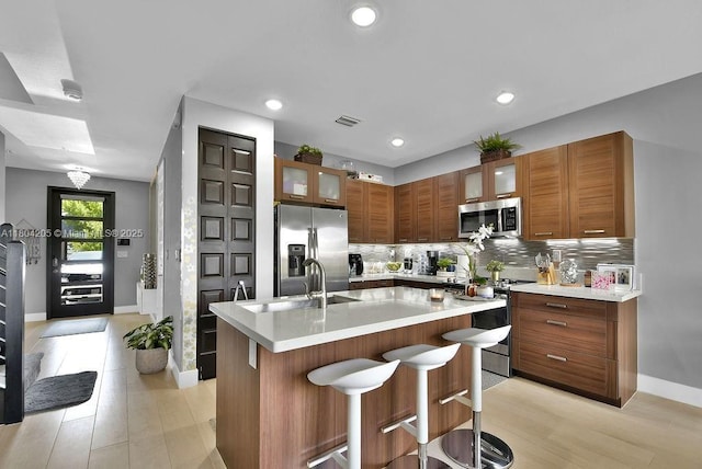 15678 NW 91st Ct, Miami Lakes, FL 33018 - kitchen with stainless steel appliances, a sink, tasteful backsplash, baseboards, and recessed lighting