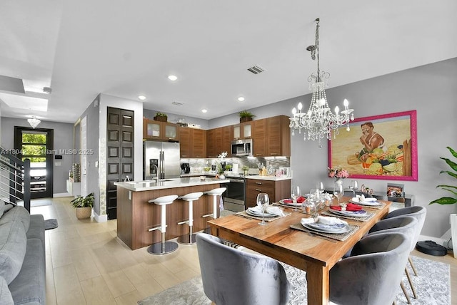 15678 NW 91st Ct, Miami Lakes, FL 33018 - dining area with baseboards, a chandelier, and recessed lighting