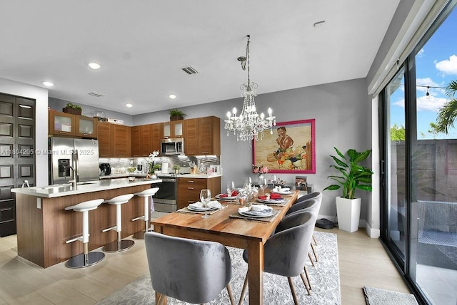 15678 NW 91st Ct, Miami Lakes, FL 33018 - dining space featuring recessed lighting and a chandelier