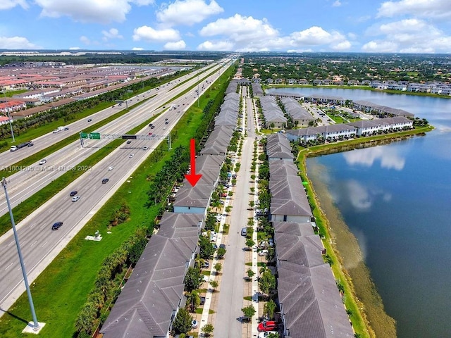 15678 NW 91st Ct, Miami Lakes, FL 33018 - aerial view of residential area with a major roadway and a nearby body of water