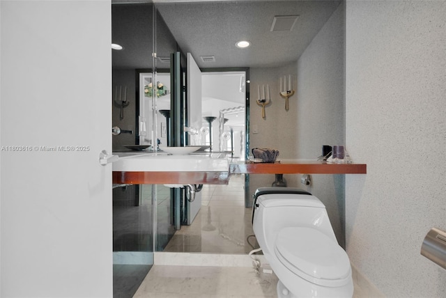 16485 Collins Ave Unit 1236-, Corner Unit Ocean, Sunny Isles Beach, FL 33160 - half bath with toilet and a textured ceiling