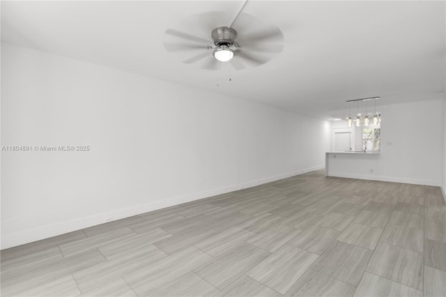 3401 Bimini Ln Unit E1, Coconut Creek, FL 33066 - empty room with ceiling fan, baseboards, and light wood finished floors
