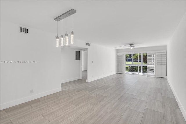 3401 Bimini Ln Unit E1, Coconut Creek, FL 33066 - unfurnished living room featuring ceiling fan, baseboards, and light wood-style flooring