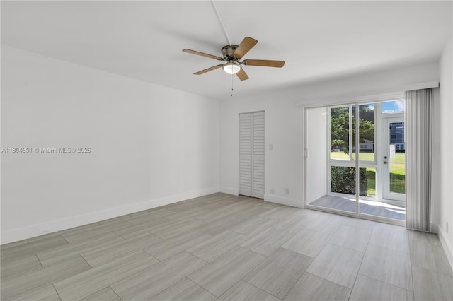 3401 Bimini Ln Unit E1, Coconut Creek, FL 33066 - spare room with a ceiling fan, baseboards, and light wood-style flooring
