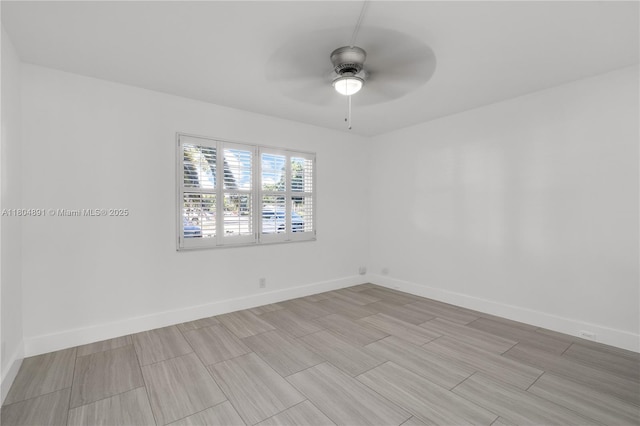 3401 Bimini Ln Unit E1, Coconut Creek, FL 33066 - spare room with a ceiling fan, baseboards, and wood finish floors