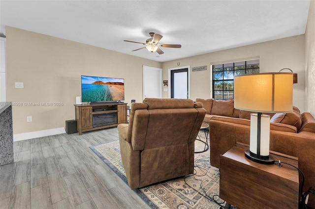 10350 SW 30th St, Miami, FL 33165 - living room featuring a ceiling fan, wood finished floors, and baseboards