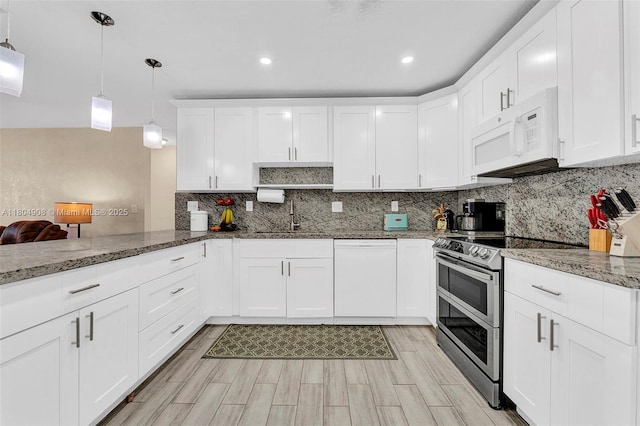 10350 SW 30th St, Miami, FL 33165 - kitchen with white appliances, a sink, backsplash, white cabinets, and recessed lighting