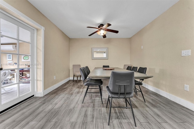 10350 SW 30th St, Miami, FL 33165 - dining area with wood finished floors, a wall mounted AC, a ceiling fan, and baseboards