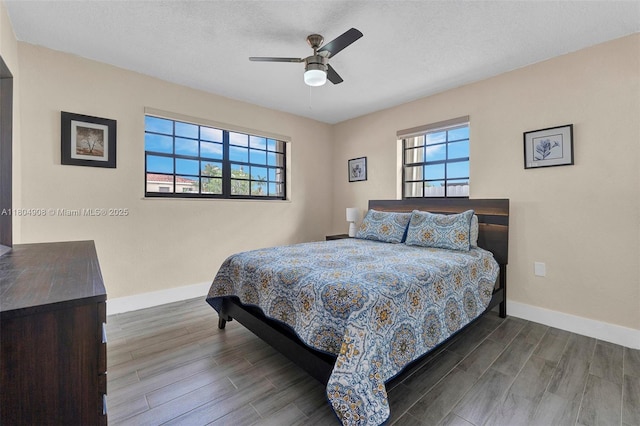 10350 SW 30th St, Miami, FL 33165 - bedroom featuring baseboards, wood finished floors, a ceiling fan, and a textured ceiling