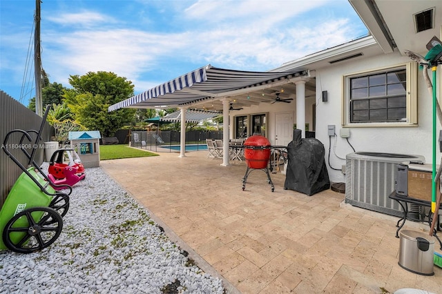 10350 SW 30th St, Miami, FL 33165 - view of patio / terrace with central AC unit, a ceiling fan, and a fenced backyard