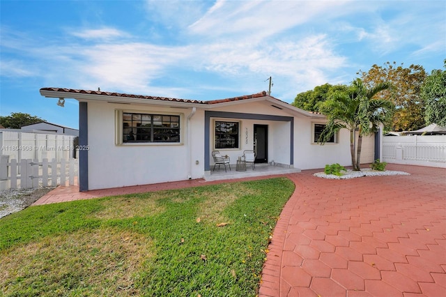 10350 SW 30th St, Miami, FL 33165 - view of front of property featuring stucco siding, a patio, and a tile roof