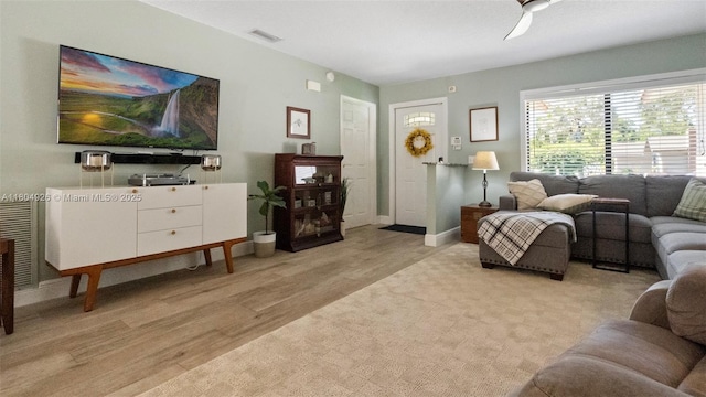 4955 NW 10th St, Coconut Creek, FL 33063 - living area with light wood-style floors, ceiling fan, and baseboards