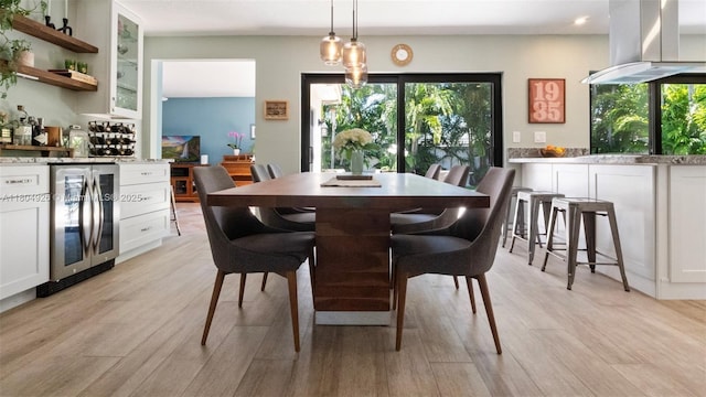 4955 NW 10th St, Coconut Creek, FL 33063 - dining area with beverage cooler, plenty of natural light, light wood-style flooring, a bar, and recessed lighting