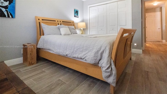 4955 NW 10th St, Coconut Creek, FL 33063 - bedroom featuring wood finished floors, baseboards, and a closet
