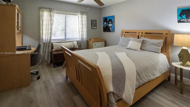 4955 NW 10th St, Coconut Creek, FL 33063 - bedroom featuring wood finished floors and a ceiling fan
