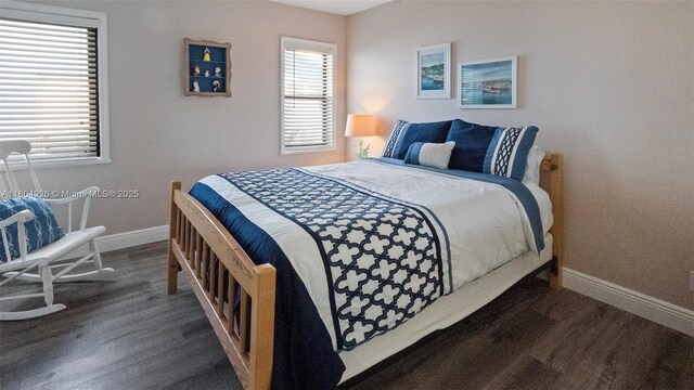 4955 NW 10th St, Coconut Creek, FL 33063 - bedroom with baseboards and dark wood-style flooring
