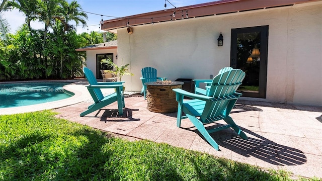 4955 NW 10th St, Coconut Creek, FL 33063 - view of patio / terrace featuring a fire pit and an outdoor pool