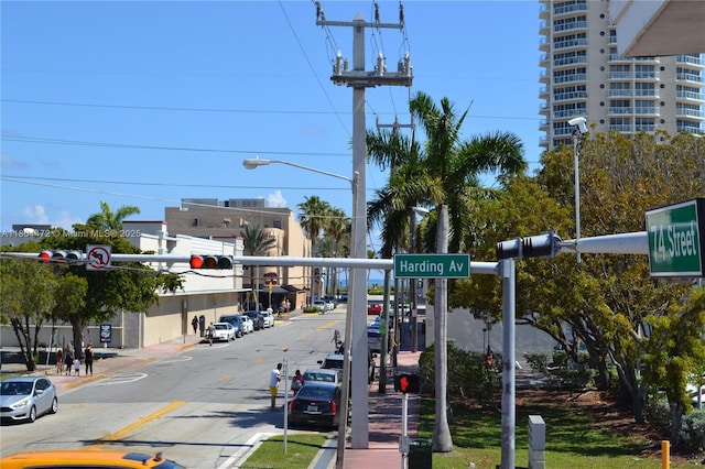 300 74th St Unit 10, Miami Beach, FL 33141 - view of asphalt road featuring traffic lights, street lights, curbs, and sidewalks