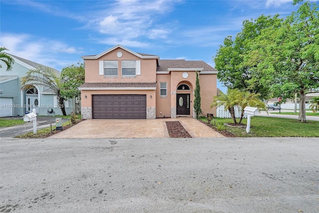 10920 SW 11th Ct, Davie, FL 33324 - view of front of home featuring stucco siding, an attached garage, concrete driveway, and roof with shingles
