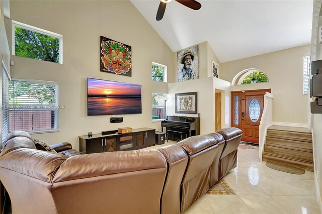 10920 SW 11th Ct, Davie, FL 33324 - living room with high vaulted ceiling, light tile patterned flooring, a ceiling fan, stairway, and baseboards