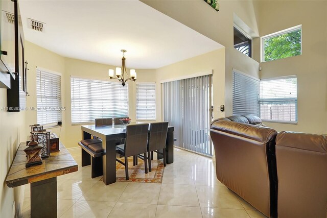 10920 SW 11th Ct, Davie, FL 33324 - dining area with a chandelier and light tile patterned flooring