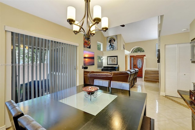 10920 SW 11th Ct, Davie, FL 33324 - dining area with light tile patterned floors, a chandelier, baseboards, and a towering ceiling