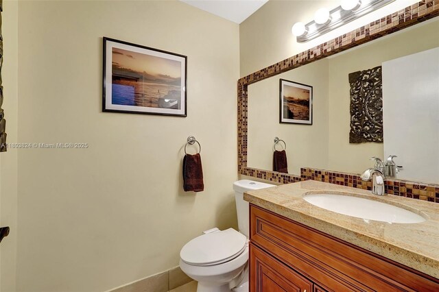 10920 SW 11th Ct, Davie, FL 33324 - half bathroom with tasteful backsplash, toilet, and vanity