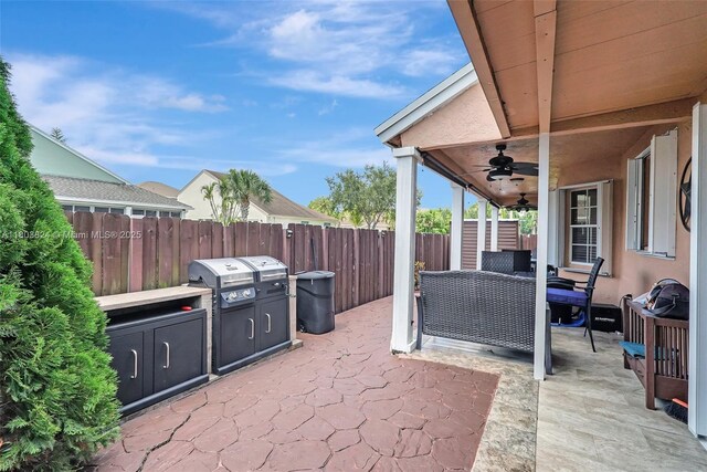 10920 SW 11th Ct, Davie, FL 33324 - fenced backyard featuring a patio area and a ceiling fan