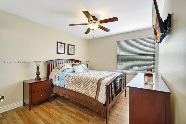 10920 SW 11th Ct, Davie, FL 33324 - bedroom with light wood-type flooring, baseboards, and a ceiling fan