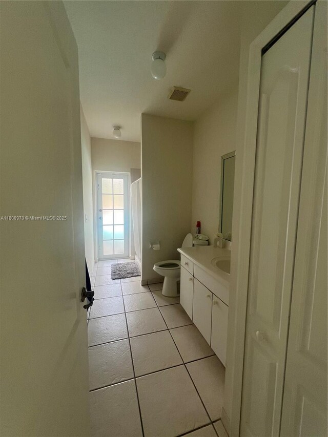9942 SW 158th Ct, Miami, FL 33196 - bathroom featuring tile patterned floors, vanity, toilet, and a shower with curtain