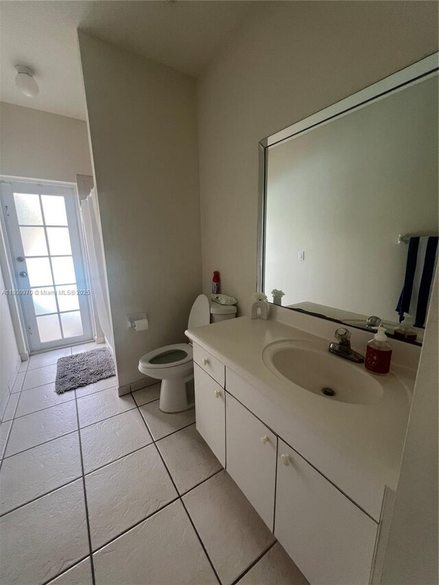9942 SW 158th Ct, Miami, FL 33196 - bathroom with tile patterned floors, vanity, toilet, and curtained shower
