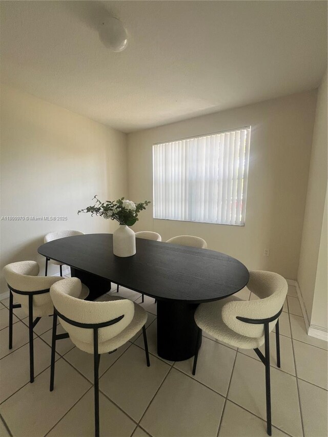 9942 SW 158th Ct, Miami, FL 33196 - dining space featuring light tile patterned floors and baseboards