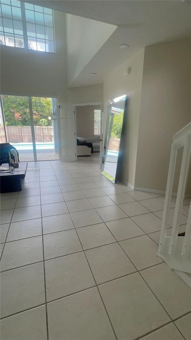 9942 SW 158th Ct, Miami, FL 33196 - corridor with light tile patterned floors, healthy amount of natural light, and baseboards