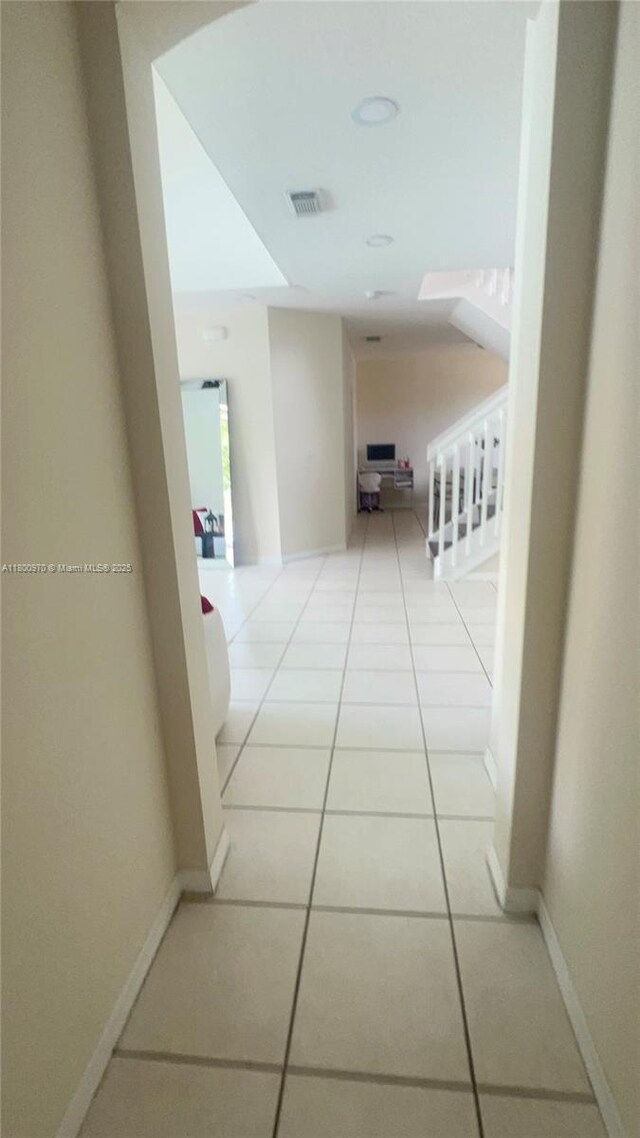 9942 SW 158th Ct, Miami, FL 33196 - hall with light tile patterned floors and baseboards