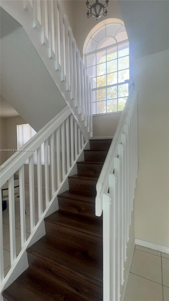 9942 SW 158th Ct, Miami, FL 33196 - staircase with baseboards and tile patterned floors