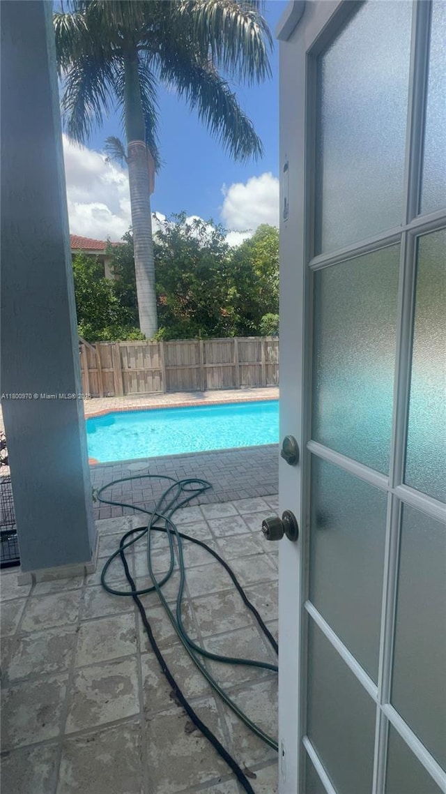 9942 SW 158th Ct, Miami, FL 33196 - view of swimming pool with a fenced backyard