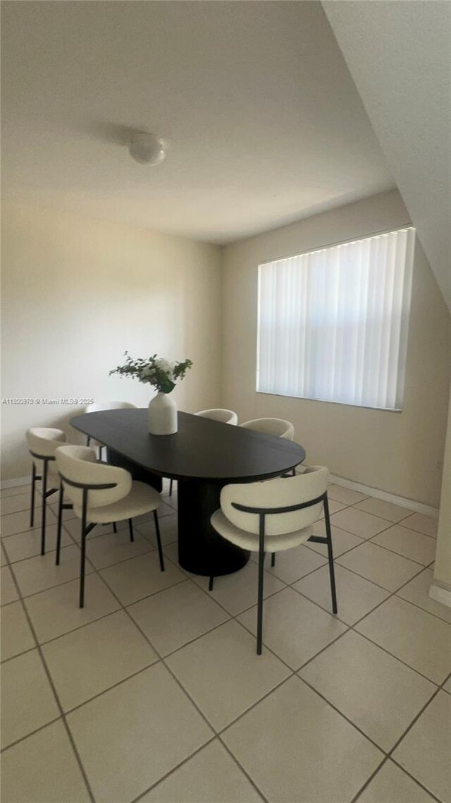 9942 SW 158th Ct, Miami, FL 33196 - dining area with light tile patterned floors and baseboards