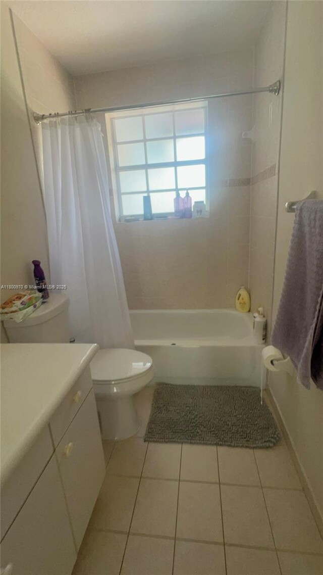 9942 SW 158th Ct, Miami, FL 33196 - full bathroom with tile patterned flooring, toilet, shower / tub combo, and vanity